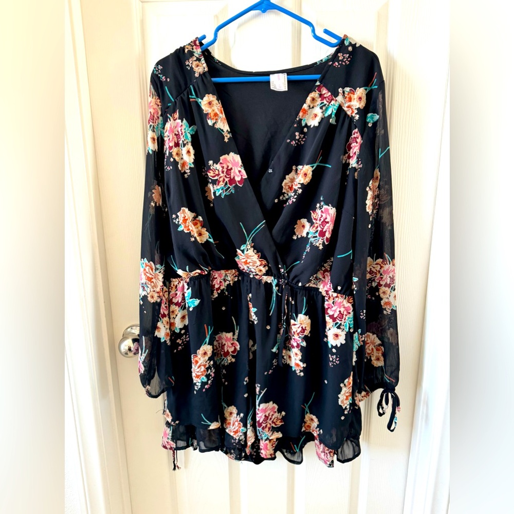 Flower romper with ruffle detail.